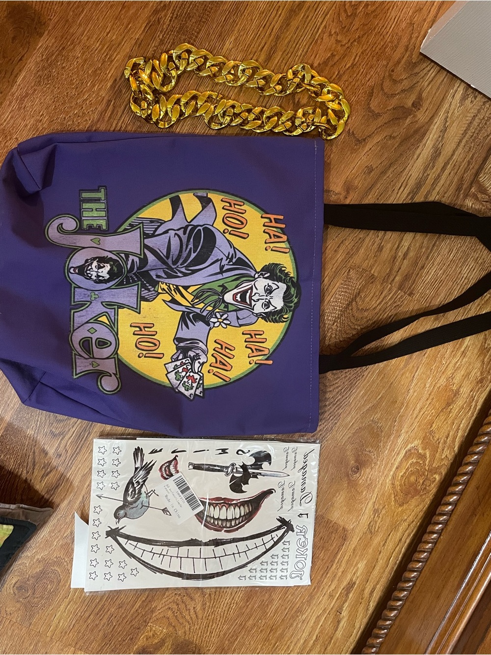 Purple Joker Graphic Backpack with Gold Chain Accent